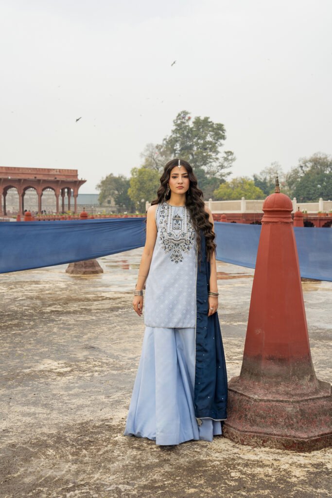 Chandni Qamar: pale blue embroidered kameez with flared trousers and a navy dupatta