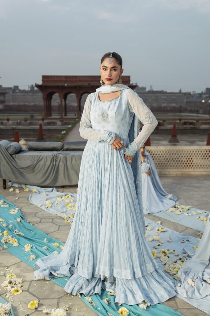 Model in a pale blue pleated Anaa Khan gown on a Mughal rooftop